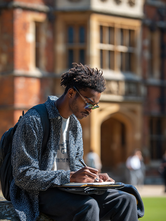 A student at university with their Apple iPad.