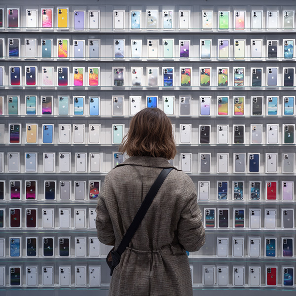 A woman browsing in a store for a new phone